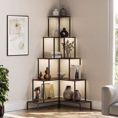 a corner shelf with vases and other items on it next to a couch in a living room