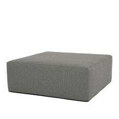 a large gray ottoman sitting on top of a white floor