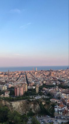 an aerial view of a city and the ocean