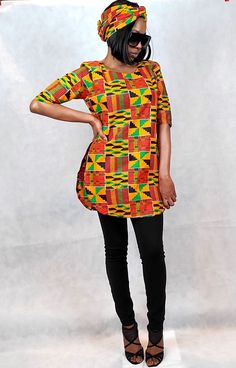 "The Zie Tunic top is in vibrant African Kente fabric. This long ankara top has two slits down the sides for a peek at your denim (or whatever pants, short or pencil skirt choose to wear with this!). An awesome resort wear too! Great African Attire outfits for church, casual, work, travel, vacation and much more! Get the matching headwrap to your blouse!  https://www.etsy.com/listing/828883859/african-kente-head-wrap-mask-set-vibrant See more  African Print Tops for Women! https://www.etsy.com/s African Attire Outfits, Kitenge Tops For Ladies, Ankara Blouses For Women, African Print Tops For Women, Kitenge Tops, Print Tops For Women, Outfits For Church, African Pants, Outfit For Church