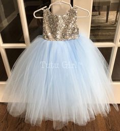 "Our sleeveless dress in Light Blue and Silver (colors can be changed)! It features silver sequins and a tulle skirt in light blue. This listing is only for the dress - hair bow pictured is not included. We don't sell this hairbow and the pink dress is shown just how this style looks modeled. We offer the following sequin colors: champagne, light gold, gold, blush gold (rose gold), blush pink, silver, white, navy, fuchsia and black. Tulle colors: https://img0.etsystatic.com/000/0/5221751/il_full Sleeveless Blue Tutu Dress For Dress-up, Spring Sleeveless Pageant Dress For Dress-up, Spring Sleeveless Pageant Dress, Sleeveless Spring Pageant Dress, Sleeveless Sequin Dress With Glitter Tulle, Spring Sleeveless Princess Pageant Dress, Blue Sequin Dress For Dress-up, Sleeveless Sequined Princess Wedding Dress, Sleeveless Tulle Pageant Dress For Dress-up