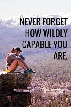 a woman sitting on top of a rock with the words never forget how wildly capable you are