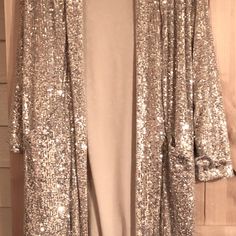 Women's Silver Sequined Party Jacket. It Has Slits On Both Sides And Size M, New With Tags. Fitted Cardigan For Fall Party, Gold Outerwear For Party Season Night Out, Gold Outerwear For Night Out And Party Season, Gold Outerwear For Party Season And Night Out, Holiday Party Long Sleeve Cardigan, Glamorous Fitted Evening Cardigan, Chic Holiday Outerwear For Night Out, Gold Cardigan For Winter Party, Gold Cardigan For Fall Party