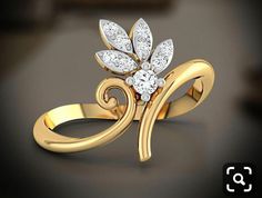 a gold ring with white stones on the top and an elegant flower in the middle