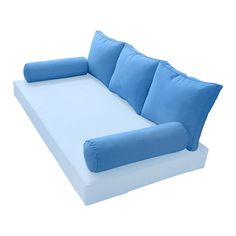 a large blue couch with pillows on it's back and side facing each other