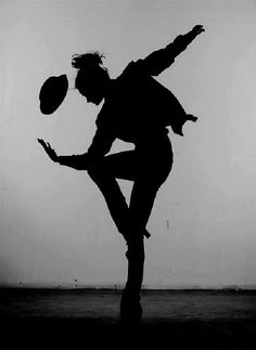 a man is dancing with a hat on his head and the words, everything in the universe has rhythm