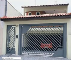 a car is parked in front of a garage