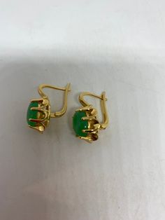 Vintage nephrite Jade golden bronze earrings These earrings are about a half an inch long All jewelry is shipped free in the US in a nice gift box. Check out our over a THOUSAND great reviews Green Lever Back Earrings As A Gift, Green Formal Earrings With Ear Wire, Oval Clip-on Earrings For Gift, Classic Jade Earrings As Gift, Gold Jade Earrings With Ear Wire, Yellow Gold Jade Earrings For Anniversary, Oval Jade Earrings For Gift, Formal Yellow Gold Jade Earrings, Classic Green Clip-on Earrings As Gift