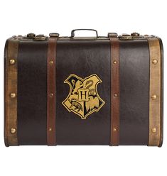 a harry potter suitcase with hogwarts crest on the front and gold trimming