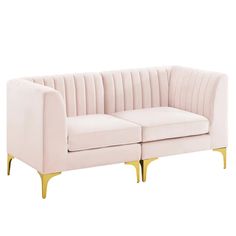 a pink couch with gold legs on a white background