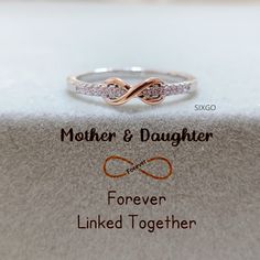 With a meaningful message card included, this ring is the perfect gift for either mom or daughter. It also serves as a reminder that the love between mother and daughter is forever linked together. CARD MESSAGE Mother & Daughter Forever Linked Together. SPECIFICATIONS Size: US 5-10 Stone: AAA Grade Cubic Zirconia Metal: 925 Sterling Silver WHAT'S IN THE BOX 1*Mother Daughter Ring 1*Full-designed gift card 1*Silver polishing cloth 1*Free box If you have any questions about the ring, please contac Mom And Daughter Rings, Gift Sterling Silver Infinity Stackable Rings, Sterling Silver Infinity Stackable Rings As Gift, Meaningful Rings For Wedding And Mother's Day, Mother's Day Infinity Adjustable Rings, Meaningful Wedding Rings For Mother's Day, Dainty Infinity Stackable Rings For Gift, Dainty Infinity Stackable Rings As Gift, Wedding Rings For Mother's Day