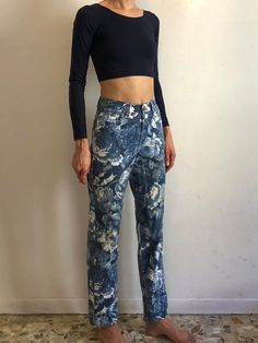 Amazing blue floral 1980s Kenzo Jeans!Great all over mega lush flower print. Classic jeans style. Medium weight cotton denim. Five pockets. Five button front fly (all the buttons have the Kenzo face!)Kenzo face patch on back pocket.Leg has just the slightest taper. Label Kenzo Jeans, Miyuki, size US28, 100% cotton, please wash cool delicate and drip dry. Very good vintage condition with no fabric or sewing flaws. Print looks vintage and a bit faded however I believe this is fully intentional. Me Trendy Floral Print Cotton Jeans, Casual Cotton Jeans With Floral Print, Relaxed Fit Floral Print Cotton Jeans, Vintage Floral Print Straight Leg Bottoms, Blue Floral Print Straight Leg Bottoms, Retro Jeans With Graphic Print For Spring, Relaxed Fit Floral Print Denim Jeans, Relaxed Fit Blue Floral Bottoms, Relaxed Fit Floral Print Jeans In Denim