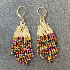 White brick stitch earrings with assorted rainbow fringe. Approx length of 7cm. Fish hook earring findings are also available, please DM me with this request! These earrings are made with a rainbow bead mix and coloring may vary slightly. Up to 7-10 day processing time for woven products, but turn around may be faster depending on my order queue. Rainbow Fringe, Stitch Earrings, Beaded Earring, Brick Stitch Earrings, White Brick, Rainbow Beads, Fish Hook Earrings, Brick Stitch, Earring Findings