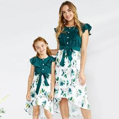 PatPat Mommy and Me Ruffle Floral Printed Stitching Solid Dresses (WomenBabiesGirls) are PatPat's exclusive and explosive sleeveless dresses. 1. All clothes are made of 100% Polyester, which will not cause any damage to the skin, soft and comfortable, and elastic at the waist. 4. The top of the dress is designed with green solid color printing. The bottom is designed with white flowers printing. The slightly stretchy fabric feels soft and comfortable. The whole set of clothes is cute, beautiful High Low Dress Formal, Floral Print Sundress, Halter Bodycon Dress, Mommy And Me Dresses, Sequin Bridesmaid Dresses, Pink Dress Women, Dresses Green, Women Bodycon Dress, Ruffle Sleeve Dress