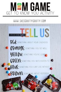 candy bar game with the words tell us on it and some candies scattered around