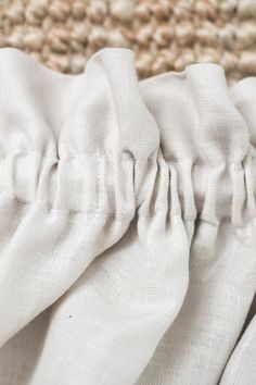 closeup of white fabric on the back of a chair