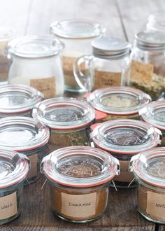 several jars filled with different types of spices