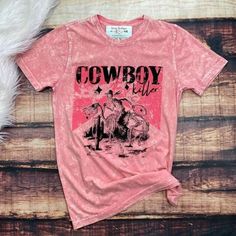 Cowboy Killer! Kill 'Em In This Pink Acid Wash Tee Shirt Country Skeleton Wranglin On A Horse Print 100% Cotton S: 19 Inches Armpit To Armpit/29 Inches In Length M: 21 Inches Armpit To Armpit/30 Inches In Length L: 22.5 Inches Armpit To Armpit/31 Inches In Length Rodeo Short Sleeve Shirt, Pre-shrunk, Pink Distressed Graphic Tee, Western Style Washed Cotton Tops, Pink Distressed Cotton Tops, Summer Rodeo Shirt With Graphic Print, Summer Graphic Print Shirt For Rodeo, Casual Cotton T-shirt For Rodeo, Pink Short Sleeve Western Top, Rodeo Screen Print Crew Neck Top