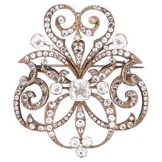 Fantastic Oversized antique French brooch. A very nice early French piece, created during the Georgian period, around the 1810's. Carefully crafted in solid .830/1000 sterling silver and suited at the reverse, with a hinged horizontal pin with a hook lock. Is embellished, with a mix of larger quartz gems cuts and small simulated gemstones in paste. Excellent workmanship with black dots and prong set on top of the silver with open backs. Paste, is a gem like material made from a secret formula of Antique Wedding Jewelry, Paste Jewelry, Early French, Antique Brooches, Art Nouveau Jewelry, Retro Jewelry, Rings Cool, Leaded Glass, Victorian Jewelry