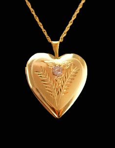 "A touching gift from the heart. There is room inside for those favorite pictures of your loved ones past or present. IT is 14kt yellow gold , . This has the original celluloid clear sleeves that go over the photos too. All original. The 14kt gold chain is 16\" and original to the locket.  See photos for size, condition and more views.  4-1-21" 14k Stamped Pendant Locket Necklace For Wedding, Gold Heart Necklace With Birthstone For Wedding, Heirloom Hallmarked Locket Necklace For Anniversary, Gold Heart Necklace Stamped 14k For Wedding, 14k Gold Heart Pendant Locket For Anniversary, 14k Gold Hallmarked Locket Necklace For Wedding, 14k Gold Heart Pendant Locket Necklace For Anniversary, 14k Gold Locket Necklace Pendant For Wedding, Victorian Heart Locket Necklace For Anniversary