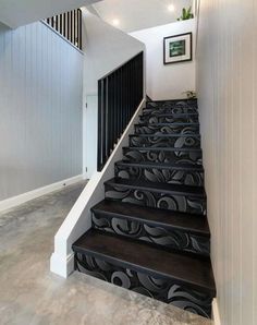 the stairs are decorated with black and white designs