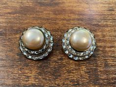 Dazzling Pearl & CZ clip on earrings! very unique vintage jewelry. 1 inch circles. Perfect condition. Vintage Round Clip-on Jewelry, Round Vintage Clip-on Jewelry, Antique Round Clip-on Earrings For Anniversary, Vintage Round Clip-on Earrings For Gift, Vintage Round Clip-on Earrings As Gift, Vintage Round Pearl Earrings For Anniversary, Retro Round Earrings For Anniversary, Vintage Round Earrings With Screw Back, Vintage Round Screw Back Earrings