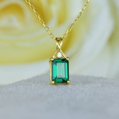 14K Gold Emerald Cut Necklace, Emerald Solid Necklace, Emerald Pendant Necklace, Dainty Emerald Necklace, Gift For Her, Mothers Day Gift Item Main Gemstone: AAA Grade Emerald Cubic Zirconia Size: 7x5mm - 1*mm Color: Green Shape: Emerald Cut Average Quality: AAA+ Side Gemstone: AAA Grade White Cubic Zirconia  Color : White Shape :Round 🎉All of gold options of the product are produced from solid gold. 🎉While using the product, it's healthier to avoid touching the cream and similar products in terms of cleaning the product. 🎉Items are shown larger in pictures to show details-please note the dimensions. Package 🎀 All of these products are sent carefully packed in elegant jewelry boxes. 🎁 How to order 🤳🏼 🎉First step: Click on the product. 🎉Second Step: Select the material. 🎉Third Step Square Emerald Necklace, Emerald Pendant Necklace, Gold Ruby Necklace, Solid Necklace, Emerald Necklace Pendant, Catholic Necklace, Emerald Style, Emerald Pendant, Emerald Necklace