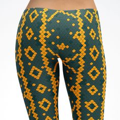 Spirit West Designs These leggings, Capri's, Yoga Pants are printed, cut and sewn in the USA. - Made of polyester/spandex fabric: 82% polyester, 18% spandex - Four-way stretch, which means fabric stretches and recovers both on the cross and lengthwise grains - Made of a microfiber yarn, which is smooth and comfortable - Elastic waistband Placement of pattern varies, designs when printed may not look exactly like example. The seam lies in the middle between the legs and down the inside of each le Orange Snake, Skin Leggings, Snake Skin Pattern, Kids Leggings, Dance Pants, Skin Pattern, Polyester Spandex Fabric, Orange And Green, Leggings Kids