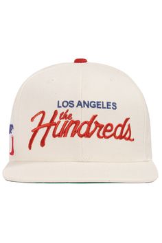 The Hundreds Team graphic embroidered on front panels Cotton Twill 6-panel structured snapback Snapback closure with Solid Bomb woven label on back left Sizes: One size fits most Colors: Blue, Off-White Timor Leste, French Guiana, New Caledonia, Woven Label, City Design, 47 Brand, Woven Labels, The Hundreds, Caicos Islands