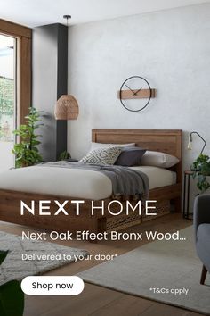 a bed room with a neatly made bed next to a window and a plant in the corner