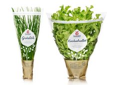 three different varieties of lettuce are shown in plastic cups with gold trimmings