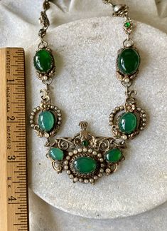 "Stunning Circa 1800s Victorian Austro Hungarian Green Chrysoprase Pearl Silver Gilt Royal Crown Antique Necklace Measures aprox 16 1/2\" Around Weighs 45.8 grams See pictures next to ruler fro scale has been tested and tests silver Although this is Hungarian pice it has a very unique Italian peruzzi feel" Green Victorian Necklace For Wedding, Antique Green Jeweled Necklace, Antique Green Jeweled Necklaces, Victorian Green Jeweled Jewelry, Victorian Green Jewelry With Jewels, Heirloom Green Cabochon Jewelry, Vintage Green Emerald Necklace For Formal Occasions, Vintage Green Jewelry With Intricate Design, Victorian Green Filigree Jewelry