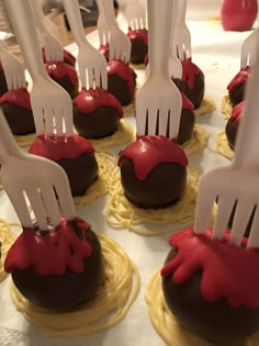 chocolate covered desserts with forks stuck in them