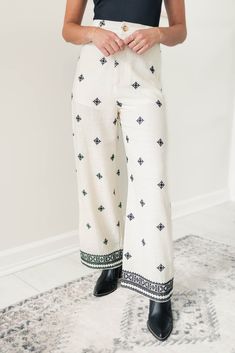 These beautiful straight leg pants feature intricate embroidery that adds a touch of elegance to any outfit. Made with high-quality materials, these pants are not only stylish but also comfortable and durable. You'll love the way you look and feel in our Vanessa Pants! Model is 5’4 wearing a size small S 0-2, M 4-6, L 8-10 70% Cotton, 20% Linen Straight leg fit High-waisted Short-lined Functional pockets Traditional Embroidered Ankle-length Bottoms, Embroidered Cotton Ankle-length Pants, Spring Embroidered Wide Leg Bottoms, Embroidered Wide Leg Bottoms For Spring, Embroidered Wide Leg Trousers For Spring, White Bohemian Straight Leg Pants, Summer Embroidered Straight Leg Bottoms, White Cotton Bottoms With Embroidered Hem, Spring Embroidered Relaxed Fit Pants