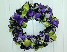 a halloween wreath with skulls and bones on it