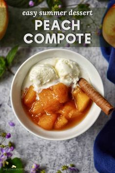 a white bowl filled with peach compote and ice cream on top of a blue towel