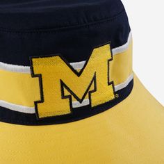 Stylish. Sporty. Simply supreme. Make sure you're ready for some fun in the sun with this Michigan Wolverines Team Stripe Boonie Bucket Hat. Features All-over, team-colored design so you can rep the team in style Embroidered team logo display, in case there were any doubts where your allegiances lie Top vent eyelets for optimal air flow and comfort Team-colored stripe accents on crown of hat for even more fashionable fandom Wide brim, versatile outdoor hat to keep you cool and comfortable Detail Summer Sports Bucket Hat With Curved Brim, Summer Sports Baseball Cap With Curved Brim, Summer Sports Bucket Hat With Brim, Curved Brim Baseball Cap For Summer Sports Events, Curved Brim Baseball Cap For Summer Sports, Brimmed Bucket Hat For Summer Sports, Yellow Baseball Cap For Summer Outdoor, Yellow Summer Baseball Cap For Outdoor, Yellow Summer Visor Baseball Cap