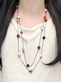 Discover the beauty of nature with our handcrafted necklace.  Featuring genuine red agate, black agate, and sandalwood beads, this necklace is a must-have for anyone seeking balance and harmony. ☯ #natureinspired #handmadejewelry #agate #sandalwood #stoneware #healing #healingstones Necklace Stack, Stone Healing, Sweater Chain, Handcrafted Necklace, Vibrant Red