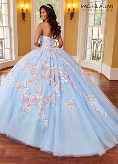 Look super cute in this 3D floral applique long cape sleeve dress with A-line skirt by Rachel Allan RQ2161. Glitter tulle quinceanera ball gown with strapless sweetheart neckline, detachable streamers, embroidery applique, 3D flowers, beads, lace-up back closure, and sweep train. 3D Floral Cape Sleeve Quinceanera Dress by Rachel Allan RQ2161 Rachel Allan La Reina Collection: Spring 2023 Style Number: RQ2161 Fabric: Tulle, Glitter Tulle, Sequin Beading, Embroidery, 3D Flowers Please note: There m Floral Cape, Cape Sleeve Dress, Rachel Allan Prom Dresses, Embroidery 3d, Quince Dress, Strapless Sweetheart Neckline, Dresses Quinceanera, Quinceanera Dress, Rachel Allan