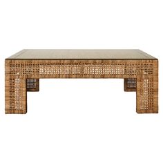 a wicker coffee table with a glass top on an isolated white background for display