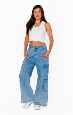 Equipped with plenty of pockets, these cargo jeans are made with wide legs and rigid denim for a relaxed, vintage-inspired look. Off-duty vibes paired with a white tank and sneakers. Bell Bottoms And Sweater, 2024 Clothes, Sparkle Skirt, Plus Size Pajamas, Rainbow Outfit, Romper And Jacket, Plus Size Swim, Denim Pants Women, Denim Sweater