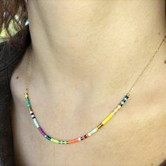 Choker necklace made with ultra-fine stainless steel chain and 0.5 mm Miyuki Delica glass beads, renowned for their delicacy and high quality. Features gold-plated steel details and closure with 5 cm extensions. Perfect for layering with other minimal necklaces for a layered look. Matching minimal bracelet available. Available in 4 mix color variations: Brown Mix Rainbow Mix Berry Mix Lagoon Mix Details and lobster clasp in gold-plated steel. Sizes available for choker/necklace 36 cm / 14.17 inc Dainty Multicolor Beaded Necklaces, Multicolor Multi-strand Tiny Beads Necklaces, Multicolor Multi-strand Beaded Necklaces With Tiny Beads, Dainty Multicolor Beaded Choker Necklace, Handmade Multicolor Multi-strand Layered Necklace, Minimal Bracelet, Steel Detail, Good Luck Gifts, Minimal Necklace