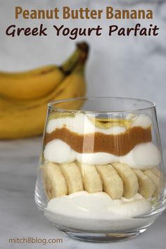 a dessert in a glass bowl with bananas and yogurt on the side for garnish