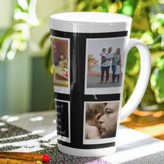 a coffee cup with photos on it sitting on a table next to some pencils