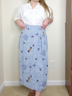 "Lovely nautical inspired wrap skirt with a button closure and front pleating. The print has sail boats, a compass, flags, and maps. Size 6 All clothing measured laying flat. Measurements: Waist - 13\"        Hips - 17.5\"    Length - 33\" Please reach out with any questions prior to purchase. All sales are final, no returns or exchanges." Wrap Pencil Skirt, Sail Boats, A Compass, Manor House, Nashville Tn, Wrap Skirt, Compass, Nashville, Boats