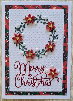 a christmas card with red and green poinsettis