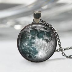 Handmade art pendant necklace featuring a magnificent blue and white full moon. You can choose your finish between antique silver, gunmetal, antique bronze or antique copper.**********************************************************************This beautiful pendant is handcrafted by me... using a high quality art print image and is protected by a beautiful crystal clear domed glass cabochon which enhances the image for a truly stunning effect!The glass cabochon measures approximately 1 inch in Handmade Moon-shaped Artistic Jewelry, Handmade Artistic Moon-shaped Jewelry, Handmade Moon Shaped Artistic Jewelry, Antique Moon Shaped Jewelry For Gift, Antique Moon Shaped Jewelry Gift, Antique Moon-shaped Jewelry Gift, Vintage Sun And Moon Design Necklace As Gift, Vintage Moon-shaped Necklace For Gift, Antique Moon Phase Jewelry Gift