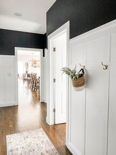 an open door leading into a dining room