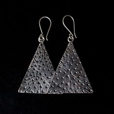 Hammered Hilltribe silver triangle earrings Approximately L 2" X W 1.25 " HillTribe SilverBecause of the high content of pure silver, these pieces are less likely to cause irritation to sensitive skin. This silver also tarnishes a bit slower which adds to its appeal as a low maintenance piece of jewellery. Unique Triangle Sterling Silver Jewelry, Sterling Silver Triangle Earrings For Pierced Ears, Handmade Triangle Sterling Silver Jewelry, Handmade Sterling Silver Triangle Jewelry, Nickel-free Triangle Sterling Silver Jewelry, Nickel Free Triangle Sterling Silver Earrings, Nickel-free Triangle Sterling Silver Earrings, Bohemian Triangle Nickel-free Earrings, Sterling Silver Triangle Jewelry With Matching Earrings