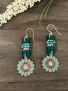 This is another new pair of earrings. These earrings are made with embossed turquoise leather with turquoise and silver beads across the front and a cute flower dangle below. They measure 2 1/2" overall. Silver plated ear wires.  #beadedartbyv #beadedearrings #beadedjewelry #HandCraftedJewelry #artisanjewelry #artisanmade #leatherandturquoise Bohemian Turquoise Flower Earrings Nickel Free, Nickel-free Turquoise Drop Flower Earrings, Turquoise Dangle Flower Earrings With Ear Wire, Turquoise Nickel-free Flower Earrings For Jewelry Making, Turquoise Leather, Cute Flower, Leather Earrings, Artisan Jewelry, Ear Wires